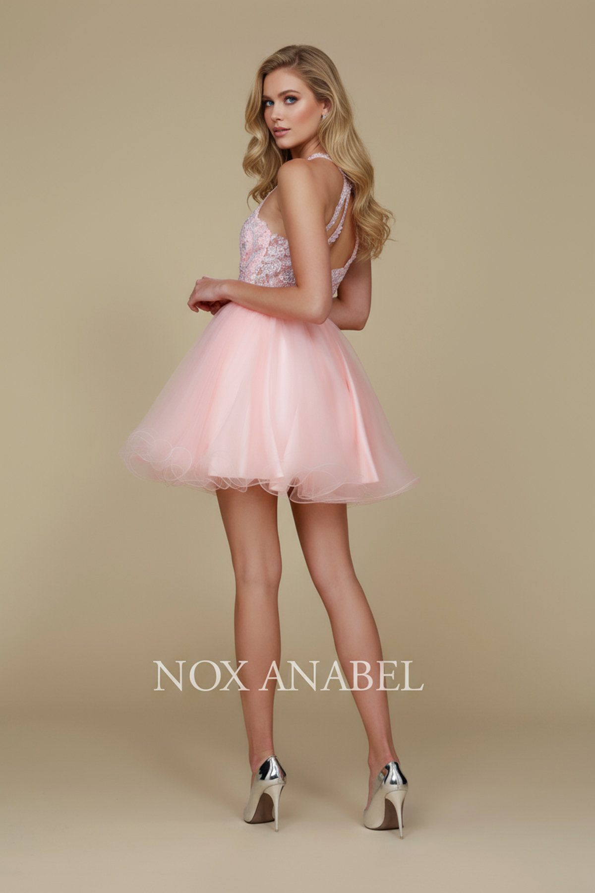 Fabulous cocktail dress featuring a flattering halter top design